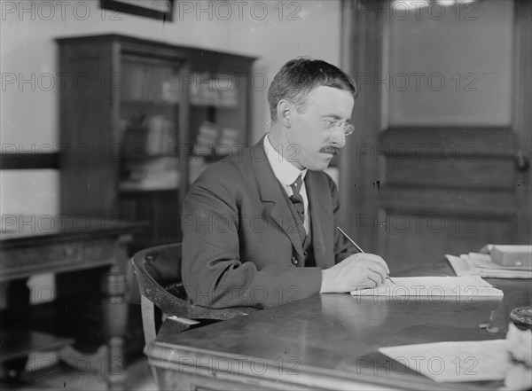 H.L. Stimson at desk writing, 1910. Creator: Bain News Service.