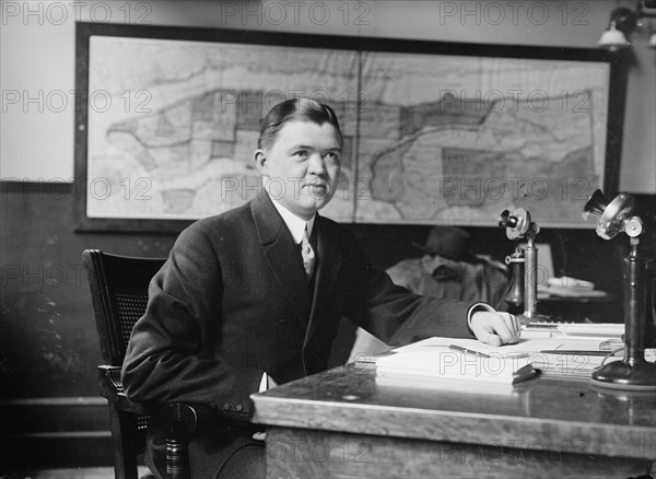 Clement Driscoll seated at desk, 1910. Creator: Bain News Service.