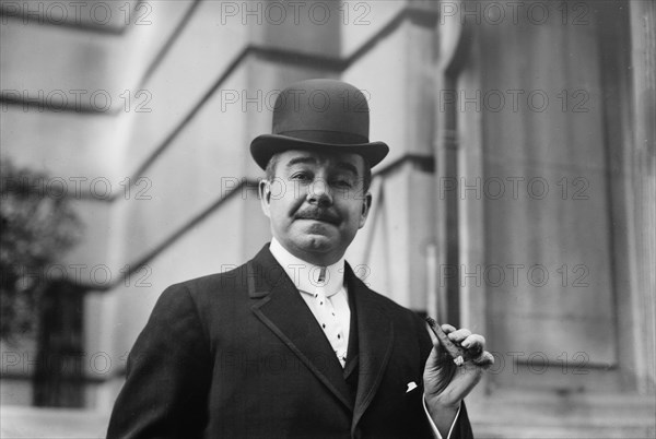 Chas. W. Murphy holding cigar, 1910. Creator: Bain News Service.