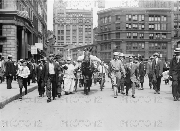 D.H. Woolf and wife arriving in N.Y.C., 1910. Creator: Bain News Service.