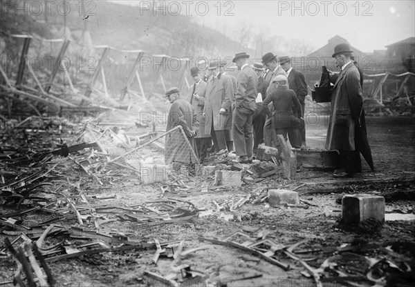 New York, NL & Philadelphia, NL players view fire damage, Polo Grounds, 1911. Creator: Bain News Service.