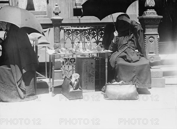 Outside church of St. Jean Baptiste, selling beads, etc., between c1910 and c1915. Creator: Bain News Service.