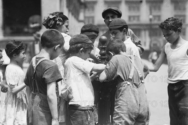 Getting drinks on hot day, between c1910 and c1915. Creator: Bain News Service.