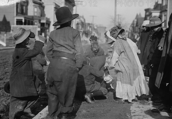 Scramble for pennies, Thanksgiving, between c1910 and c1915. Creator: Bain News Service.