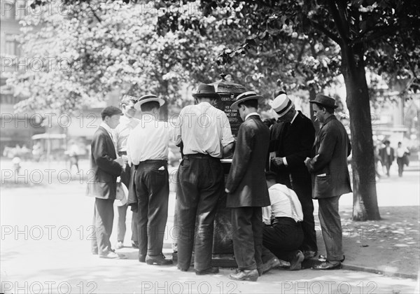 Ice water in the park--hot day, N.Y.C., between c1910 and c1915. Creator: Bain News Service.