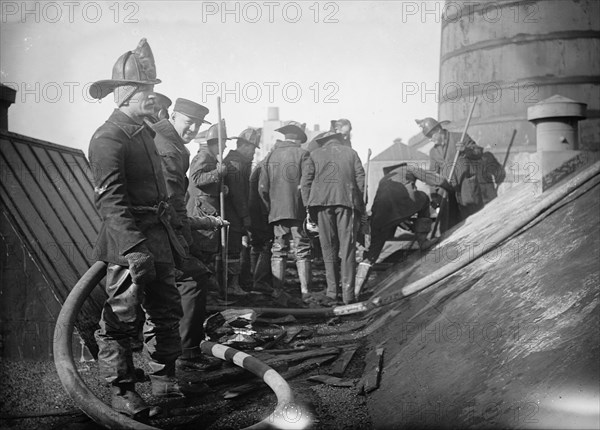 Putting out fire in Bain News Service Bldg. 1/6/12, 1912. Creator: Bain News Service.