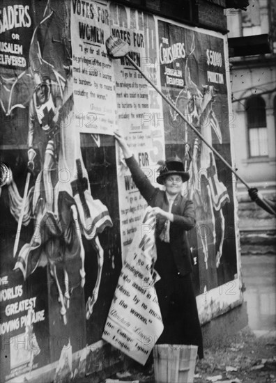 Miss Louise Hall with brush and Susan Fitzgerald assisting bill posting..., between c1910 and c1915. Creator: Bain News Service.