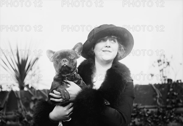 Mrs. Malcolm Strauss & "Beaux Attos" [i.e., Athos], between c1910 and c1915. Creator: Bain News Service.