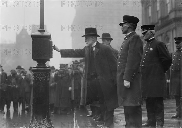 Mayor Gaynor turning in alarm 3/20/13, 1913. Creator: Bain News Service.