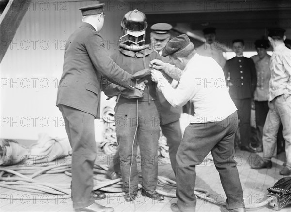 On KAISER WILHELM II - Buttoning up a fire-fighter, between c1910 and c1915. Creator: Bain News Service.