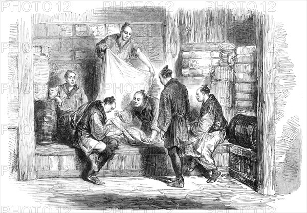 Buying camlets in a shop, Yokohama - from a sketch by our special artist, 1865. Creator: Unknown.