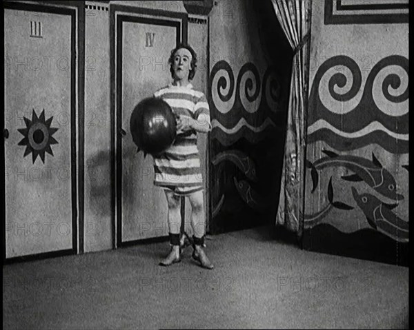 Stanley Lupino Performing in a Show in London Wearing a Stripy Bathing Suit, 1922. Creator: British Pathe Ltd.