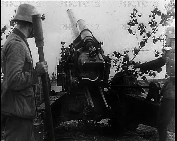 Two Male German Soldiers by an Artillery Gun, 1939. Creator: British Pathe Ltd.
