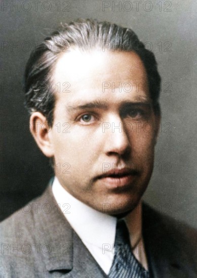 Niels Bohr, Danish physicist, c1922. Niels Henrik David Bohr (1885-1962) is best known for his work on quantum mechanics and atomic structure, for which he was awarded the Nobel Prize for physics in 1922. He later assisted the Americans with the Manhattan Project to build the atom bomb, but after the Second World War he became a strong advocate for arms control, organising the Atoms for Peace conference at Geneva in 1955. Photo courtesy of The Nobel Foundation. (Colorised black and white print).