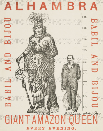Giant Amazon Queen performing at the Alhambra, 1885. Advertisement for Marian Holland, who performed as the Giant Amazon Queen, starring in the operetta, 'Babil and Bijou' at the Alhambra Theatre, Leicester Square. She was born on January 31 1866 in Benkendorf, Germany, with giantism, and was 8 feet 2 inches tall. Holland is depicted in full costume standing next to an average-sized man.