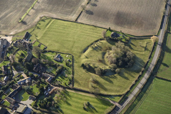 The earthwork remains of a motte and bailey castle and ridge and furrow cultivation on the outskirts of the village of Seckington, Warwickshire, 2022.