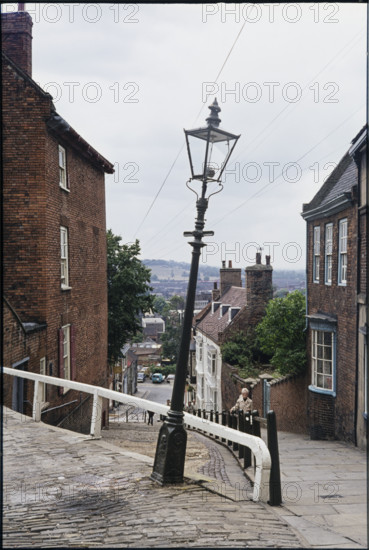 The leaning lamp post at the junction of Steep Hill and Danesgate, Lincoln, Lincolnshire, 1976. The leaning lamp post at the junction of Steep Hill and Danesgate, seen from the north.