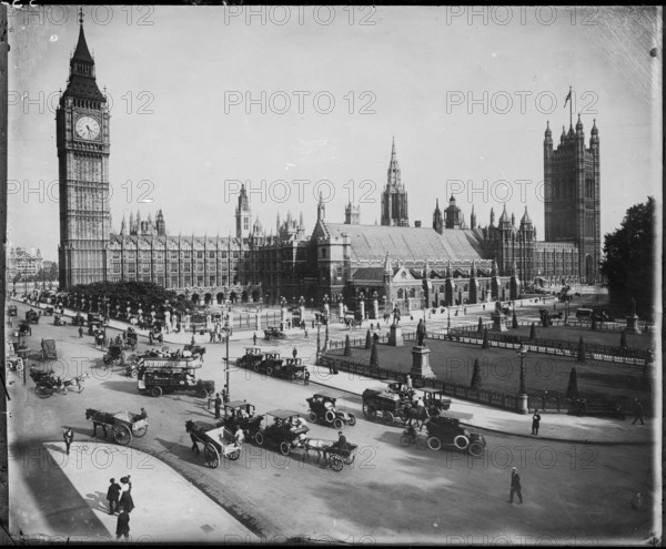 Traffic passing the Palace of Westminster on Parliament Street and Parliament Square, as seen from the north-west, 1900-15. The negative was produced from a print.