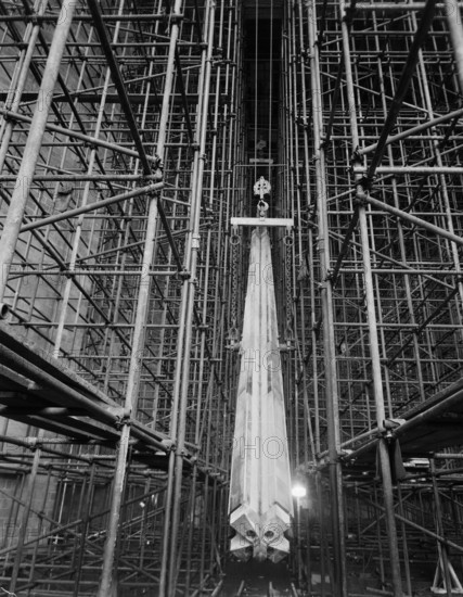 A nave column being hoisted into position during the construction of Coventry Cathedral, 1959.