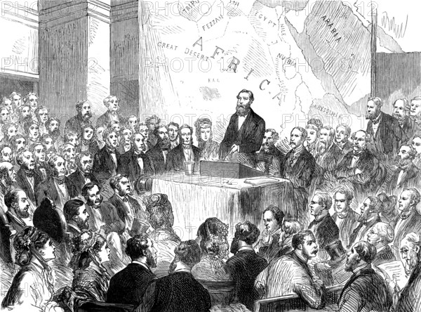 Sir Samuel Baker at the meeting of the Royal Geographical Society, 1873. 'The lecture which Sir Samuel Baker delivered...was honoured with the presence of [his] Royal Highness the Prince of Wales...The audience numbered about 1500 ladies and gentlemen, in the lecture-theatre of... the London University...The benches were crowded, and there was a crush to get in at the doors...Sir Samuel commenced by giving an account of the mission he undertook, from the Khedive or Viceroy of Egypt, to go up the Nile with a military force and put a stop to the practices of kidnapping and slave-trading...The Prince [said that] Sir Samuel...had not only maintained his high character as a traveller, a sportsman, and a Fellow of the Royal Geographical Society, but as a philanthropist he had performed a great work for the benefit of human kind. This well-merited eulogy was received with hearty cheers. Sir Bartle Frere then offered his own congratulations and those of the society to Sir Samuel and Lady Baker...