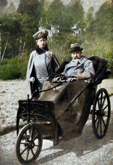 King George V (1865-1936) and Queen Mary (1867-1953) at Craigwell House, Aldwick, near Bognor Regis, c1930s (1936). George, the second son of Edward VII and Alexandra of Denmark, was born at Marlborough House on 3rd June, 1865. In 1893 he married Princess Mary (with whom he had six children) and in 1910, upon the death of his father, he became king. In 1924 he appointed Ramsay MacDonald, Britain's first Labour Prime Minister, and in 1932 he introduced the idea of broadcasting a Christmas message to the people. He died of influenza on 20th January, 1936 and was succeeded by his eldest son, Edward. From "His Majesty the King, 1910-1935", introduction by HW Wilson (Associated Newspapers Ltd, London, 1936). (Colorised black and white print).