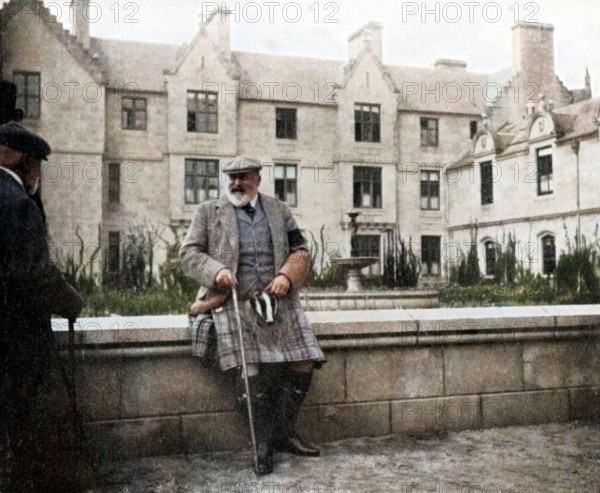King Edward VII (1841-1910) at Balmoral, Scotland, 1908. From "Queen Alexandra's Christmas Gift Book, Photographs from My Camera", by Queen Alexandra, published by The Daily Telegraph (London, 1908). (Colorised black and white print).
