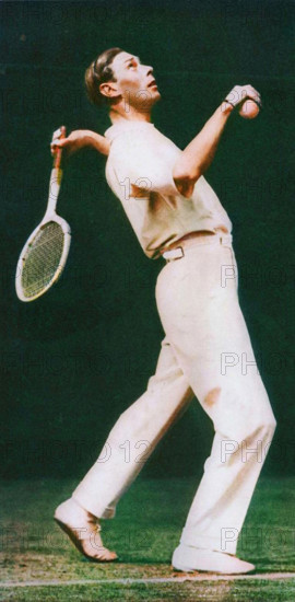'Service' - Duke of York playing tennis at Wimbledon 1926 (1937). From "Coronation Souvenir Book 1937", edited by Gordon Beckles. [Daily Express, London, 1937]. (Colorised black and white print).
