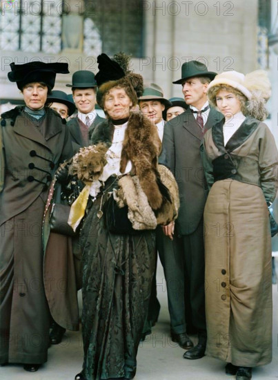 Miss Lucy Burns of C.U.W.S. - Left, with Mrs. Emmeline Pankhurst, 1913. American and British suffragists and women's rights advocates. Lucy Burns led the Congressional Union for Woman Suffrage (CUWS), was active in the National American Women Suffrage Association, and helped form the National Woman's Party. By 1913, Mrs Pankhurst, founder of the Women's Social and Political Union, had already served three prison sentences for her efforts to gain the vote for women. (Colorised black and white print).