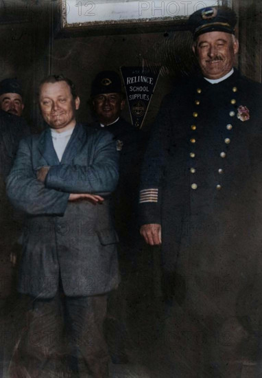 Schrank under arrest, 1912. John F. Schrank's attempted assassination of U.S. President Teddy Roosevelt in Oct. 1912. (Colorised black and white print).