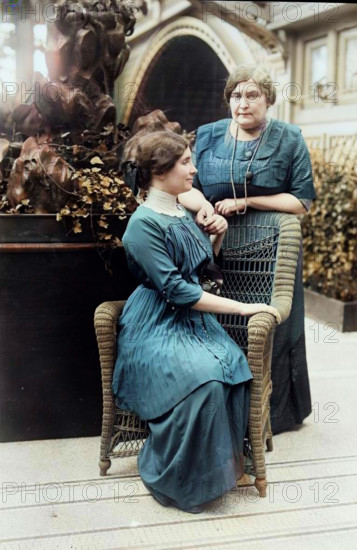 Helen Keller & Mrs. Macy, 1913. Shows Helen Keller (1880-1968) with her teacher Anne Sullivan Macy (1866-1936) possibly at the International Flower Show, New York City, April 1913. (Colorised black and white print).