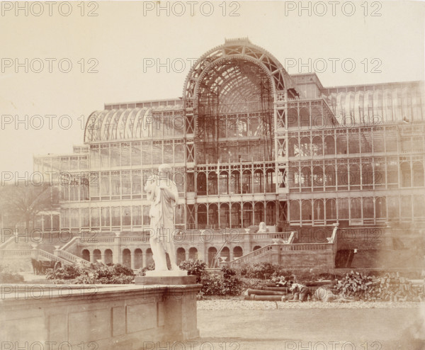 'The South Transept, from the Second Terrace', Crystal Palace, Sydenham, 1852-1854. Designed by Sir Joseph Paxton to house the Great Exhibition of 1851 in Hyde Park, the Crystal Palace was reconstructed and enlarged in Sydenham in 1852. The first column was raised on 5 August 1852 and the palace was opened by Queen Victoria on 10 June 1854. Many exhibitions and events were subsequently held at the Crystal Palace until it burnt down on 30 November 1936. The park contained a motor racing circuit from 1937 until 1972 and the famous athletics track dates back to the foundation of the Crystal Palace Athletics Club in 1868. Plate 59 from "Photographic Views of the Progress of the Crystal Palace, Sydenham. Taken during the progress of the works, by desire of the directors, by Philip H Delamotte. Together with a list of the directors and officers of the company, etc". [London, 1855].