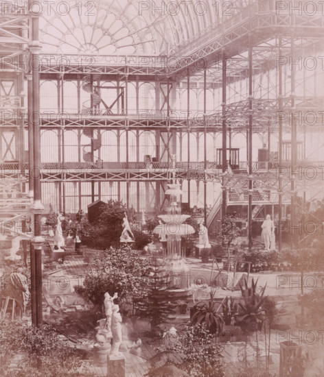 'Osler's Crystal Fountain', Crystal Palace, Sydenham, 1852-1854. Designed by Sir Joseph Paxton to house the Great Exhibition of 1851 in Hyde Park, the Crystal Palace was reconstructed and enlarged in Sydenham in 1852. The first column was raised on 5 August 1852 and the palace was opened by Queen Victoria on 10 June 1854. Many exhibitions and events were subsequently held at the Crystal Palace until it burnt down on 30 November 1936. The park contained a motor racing circuit from 1937 until 1972 and the famous athletics track dates back to the foundation of the Crystal Palace Athletics Club in 1868. Plate 79 from "Photographic Views of the Progress of the Crystal Palace, Sydenham. Taken during the progress of the works, by desire of the directors, by Philip H Delamotte. Together with a list of the directors and officers of the company, etc". [London, 1855].