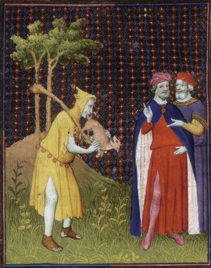 The fool of Strutt putting the tail of a small animal in his mouth, 15th century. The fool wears a yellow hooded tunic that has bells round the waist. Two men watch and point at him, smiling at the bizarre sight.