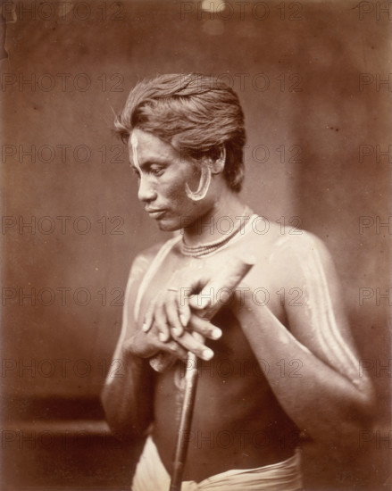 A Manipuri Polo player, 1860. This man from Manipur has face and body paint, and holds a polo stick. Manipur is an area in the far north-east of India, bordering Burma,
