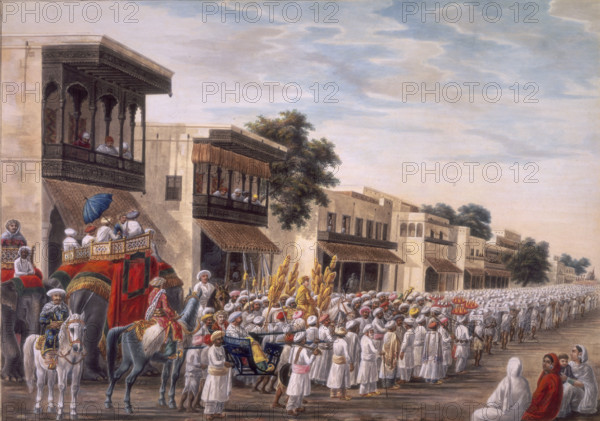 Marriage procession of a Muslim bridegroom proceeding to the bride's house, c1808. People ride on horseback, in howdahs on the backs of elephants, and by litter. The figure dressed in gold and surrounded by gold standards is the groom. Women watch at right, and men look down from carved wooden balconies. Inscribed on the back in English: 'Procession of the Sanhac'.