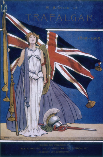 Britannia standing in front of the Union Jack, 1905. 'A souvenir of Trafalgar, 1805-1905' celebrates the centenary of the Battle of Trafalgar, a key event in the Napoleonic Wars in which Admiral Nelson fought the French and Spanish.