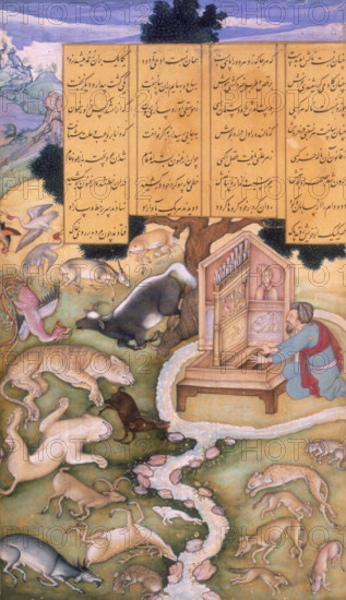 Aflatun charms the Animals by his music, 1595. Aflatun sits playing at his instrument in the middle of a small piece of land that is encircled by a river. All around him the animals lie on the ground completely taken over by the music. A section of text above Aflatun describes the scene.