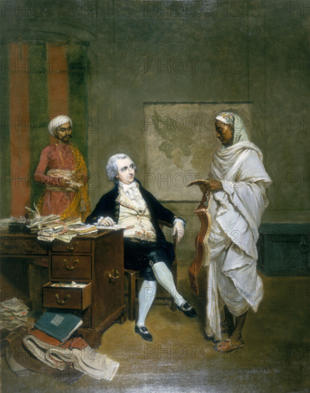 John Mowbray, Calcutta Merchant, 1790. British businessman in India. Mowbray sits at his desk which is overflowing with account books, documents and papers. He is attended by a banian, or money agent, and messenger.
