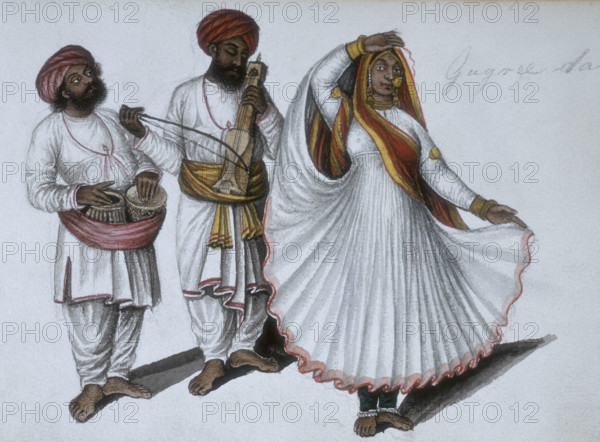 A dancing girl performing the 'Gugree' or 'gagri' dance with two musicians, 1856.