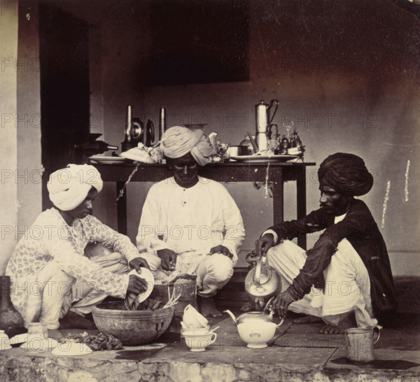 Three Indian domestic servants at work, 1870s. Washing up and making tea.
