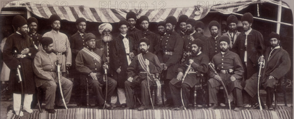 The Amir Yakoob Khan and Sirdars of Kabul at Gandamak, Afghanistan, 29 May 1879. Amir Yakub Khan, son of the overthrown Sher Ali, travelled to Gandamak, a village just outside Jellalabad, to meet the British envoy Sir Louis Cavagnari. The gathering resulted in the signing of the Treaty of Gandamak under which Afghanistan became a British Protectorate, whereby the Amir ceded territories to the British and accepted a British envoy in Kabul. The Amir is seated in the centre. Daoud Shah, from the Ghilzai tribe, his commander-in-chief, sits at his right. Despite the treaty, the war in Afghanistan was not over.