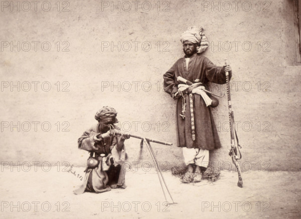 Kohistani and Hazara combatants, Kabul, Afghanistan, c1880. These men are from Kohistan, an area near the Hindu Kush, and from central Afghanistan. The gun of the man on the right has inlaid decoration.