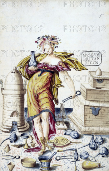 A woman surrounded by alchemical instruments. She holds a flask and a pair of tongs. To the left is a furnace, with a small flame at the bottom and smoke rising from two outlets at the top. On the floor lies a pair of bellows, a pestle and mortar, weighing scales, a funnel, tongs, and various flasks. The woman wears a wreath of flowers in her hair and roman sandals.