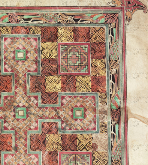Detail from the Lindisfarne Gospels, c698. The Lindisfarne Gospels is one of the most important items of Britain's literary heritage. The book was written and illuminated at the monastery of Lindisfarne, on Holy Island, off the Northumbrian coast, about 698 CE in honour of St Cuthbert, the Bishop of Lindisfarne, who died in 687. The Gospels remained at Lindisfarne until 875, when it accompanied the monks on their flight from the invading Danes. From 883 to 995 the Lindisfarne community remained at Chester-le-Street, near Durham, finally settling at Durham itself in the latter year. The manuscript probably lost its original binding at the time of the Dissolution of the Monasteries in the 16th century. Early in the 17th century it was acquired by the antiquarian Sir Robert Cotton and added to his substantial library.