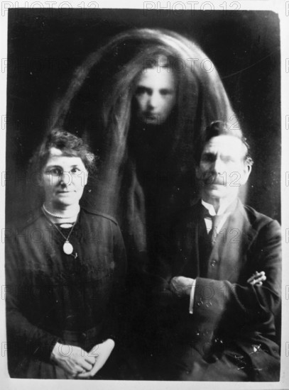 A 'psychic photograph', c1890-c1910. This photograph, which supposedly shows a ghost between a seated couple, is taken from the Barlow collection of photographs of psychic phenomena, a subject of great popular interest at the turn of the 20th century.