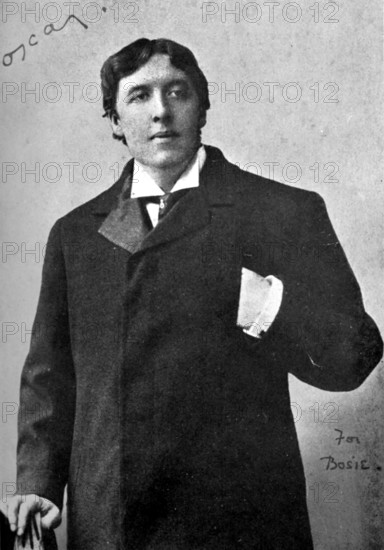 Portrait of Oscar Wilde, late 19th century. Wilde (1854-1900) studied at Trinity College, Dublin, and at Magdalen College, Oxford, where he gained a reputation for his intelligence, wit and eccentricity. His plays brought him to literary prominence. Lady Windermere's Fan (1892), A Woman of No Importance (1893), An Ideal Husband (1895), and The Importance of Being Earnest (1895), were all huge popular successes. In 1895 Wilde was found guilty of having a homosexual affair with Lord Alfred 'Bosie' Douglas (1870-1945) and was imprisoned for two years for 'gross indecency'. His Ballad of Reading Gaol (1898), written following his release, expressed his personal and harrowing experience of prison life. Wilde died in 1900 of cerebral meningitis. From "Oscar Wilde and Myself" by Lord Alfred Douglas. [London, 1914].