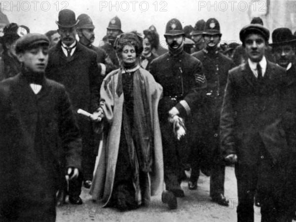 Arrest of Emmeline Pankhurst, London, 13 February 1908. Suffrage campaigner Emmeline Pankhurst was charged with obstructing a policeman while on a deputation to the House of Commons. The next day she received a sentence of six weeks in Holloway prison. The deputation to the Commons followed a meeting at Caxton Hall, where the Suffragettes learned that no mention of women's suffrage was to be made in the King's [ie Edward VII's] Speech. Mrs. Pankhurst can be seen here carrying a scroll of paper on which was written the resolution of the meeting. She was also limping, following an injury sustained the previous month (at a Devon by-election) in an altercation with Liberal party supporters. From "The Suffragette Movement. An intimate account of persons and ideals" by E Sylvia Pankhurst [Emmeline's daughter]. [1931].