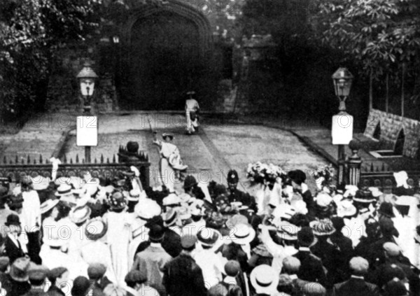Mary Leigh (waving) and Edith New, the first Suffragette window-breakers, released from Holloway Prison, London, 22 August 1908. Leigh (1885-1979) and New (1877-1951) were the first suffragettes to use vandalism as a tactic in the fight to gain votes for women. From "The Suffragette Movement. An intimate account of persons and ideals" by E Sylvia Pankhurst. [1931].