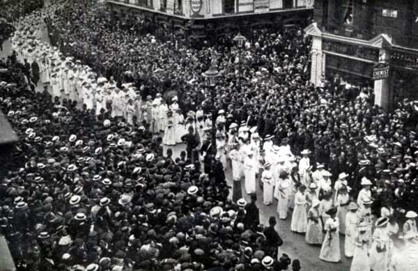 The Cortege of Emily Wilding Davison, London, June 14, 1913. British suffragette Emily Wilding Davison (1872-1913) fought for votes for women. A member of the Women's Social and Political Union (WSPU) and a militant fighter for her cause, she was arrested on nine occasions, went on hunger strike seven times and was force-fed on forty-nine occasions. She died after being hit by King George V's horse Anmer at the 1913 Derby when she walked onto the track during the race. Her funeral was organised by the WSPU. A procession of 5,000 suffragettes and their supporters accompanied her coffin and 50,000 people lined the route through London. From "The Suffragette Movement. An intimate account of persons and ideals" by E Sylvia Pankhurst . [1931].