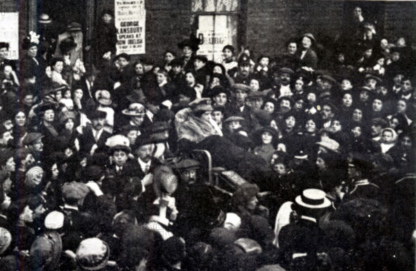 East London sets forth to interview the Prime Minister, HH Asquith, at the House of Commons, carrying Sylvia Pankhurst, London, June 10, 1914. British feminist, socialist activist and writer Sylvia Pankhurst (1882-1960) on hunger strike, carried by supporters during women's fight for the vote. A poster reads: 'George Lansbury speaks at Bow Obelisk'. From Pankhurst's "The Suffragette Movement. An intimate account of persons and ideals". [1931].